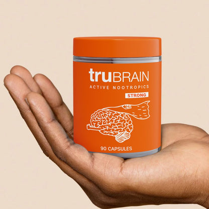 Open palm of a hand cradling a Nootropic capsules in a jar. The best nootropics to break brain fog and have less internal drama.