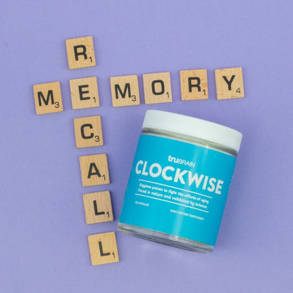 Clockwise jar amongst scrabble pieces that spell "memory recall" in a T-shape, as memory recall is one of the more noticeable traits of a brain that is aging better